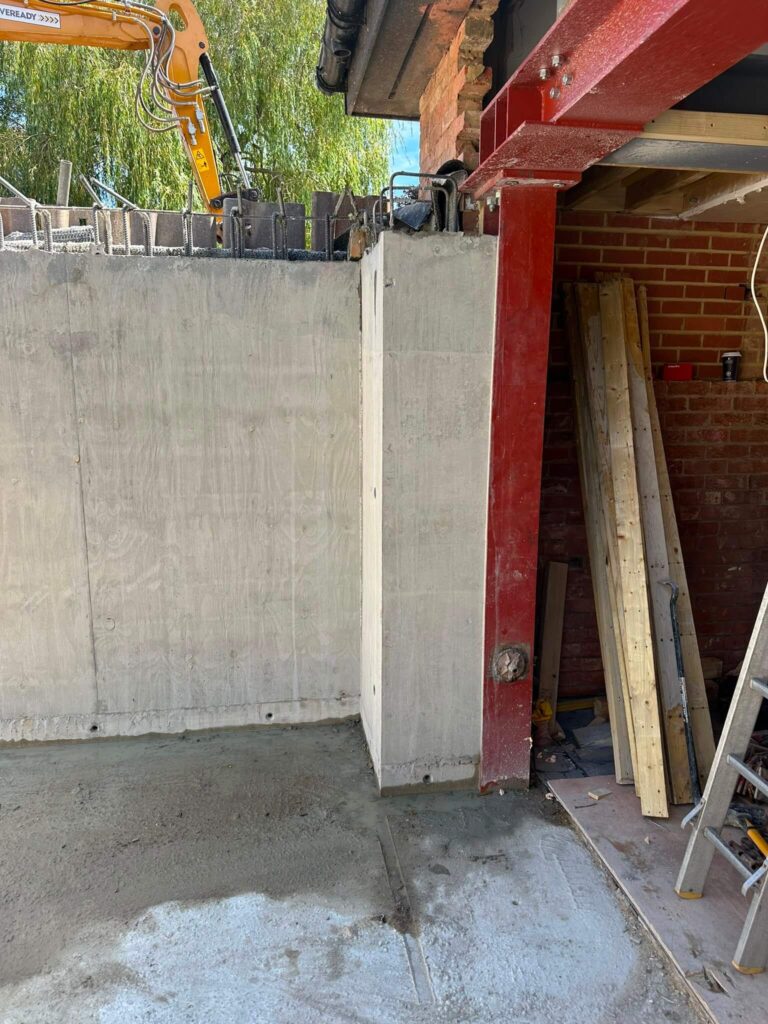 Steel column installed against the basement wall – basement construction in Beaconsfield, Buckinghamshire